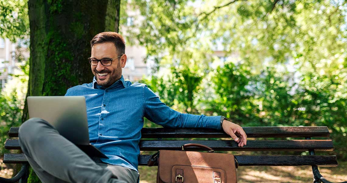 Man sitting on bench in park